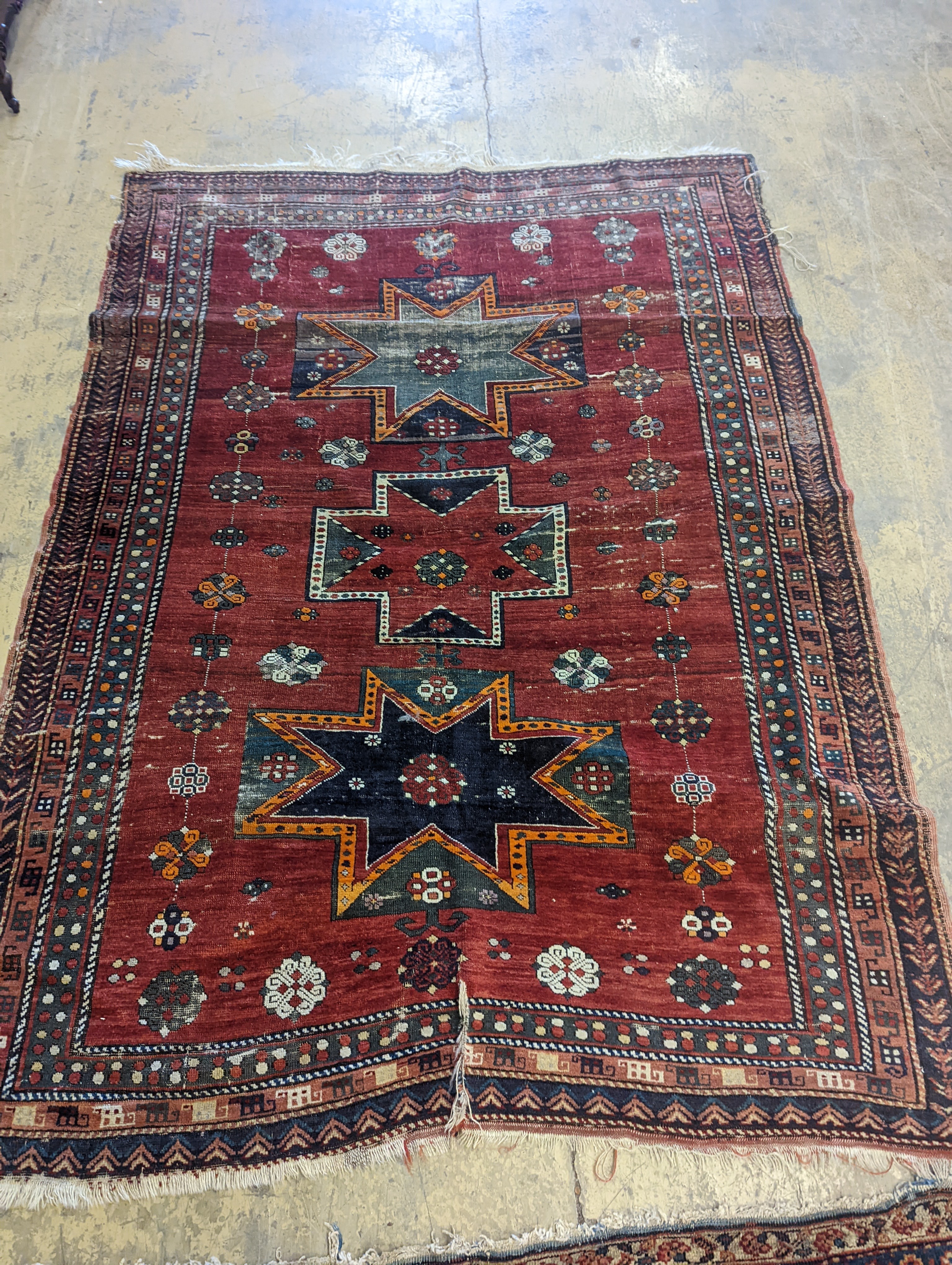 A Kazak red ground rug, 210 x 160cm